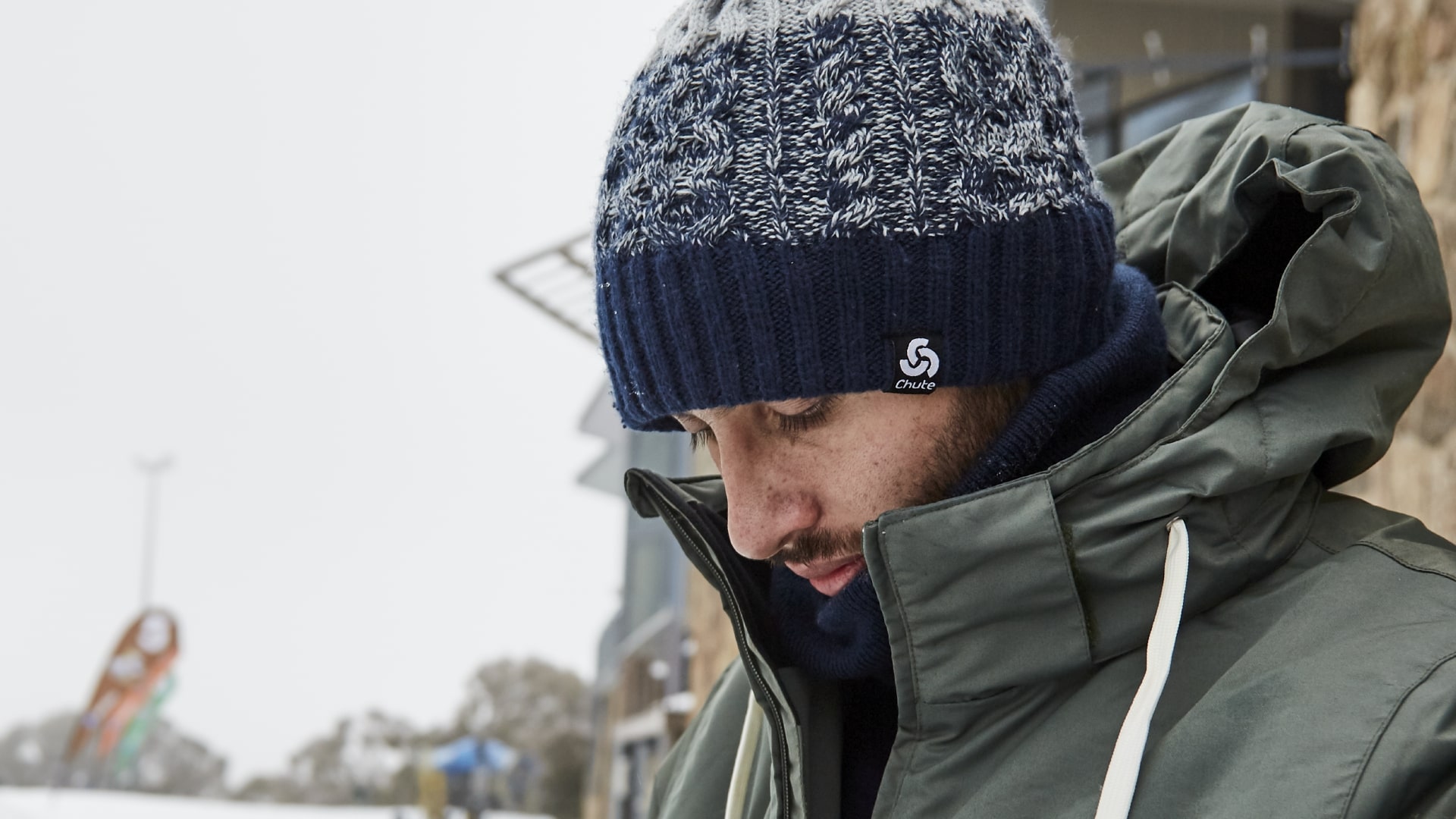 Man wearing a Chute knitted navy beanie
