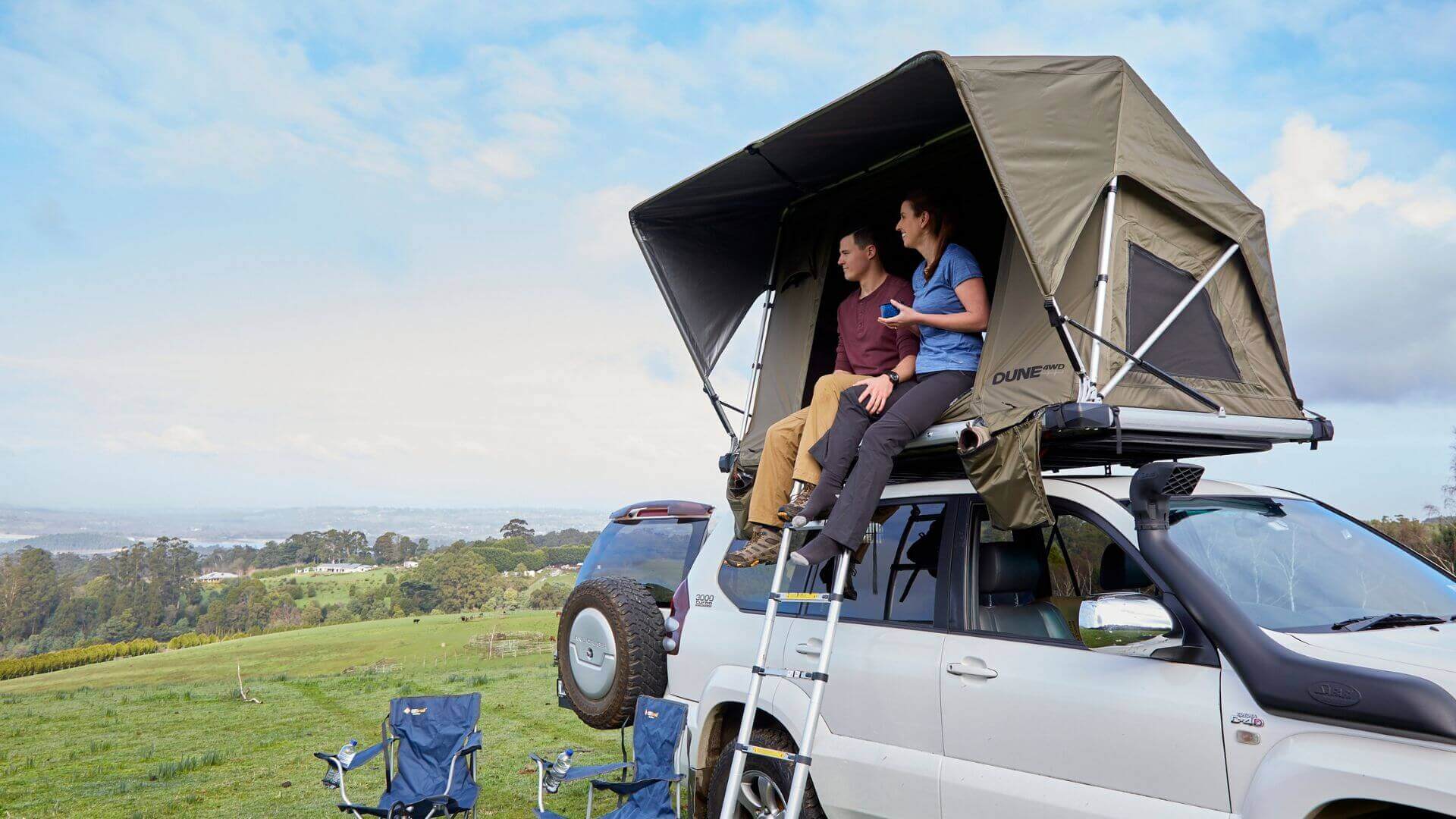 Couple In Dune 4WD Rooftop Tent