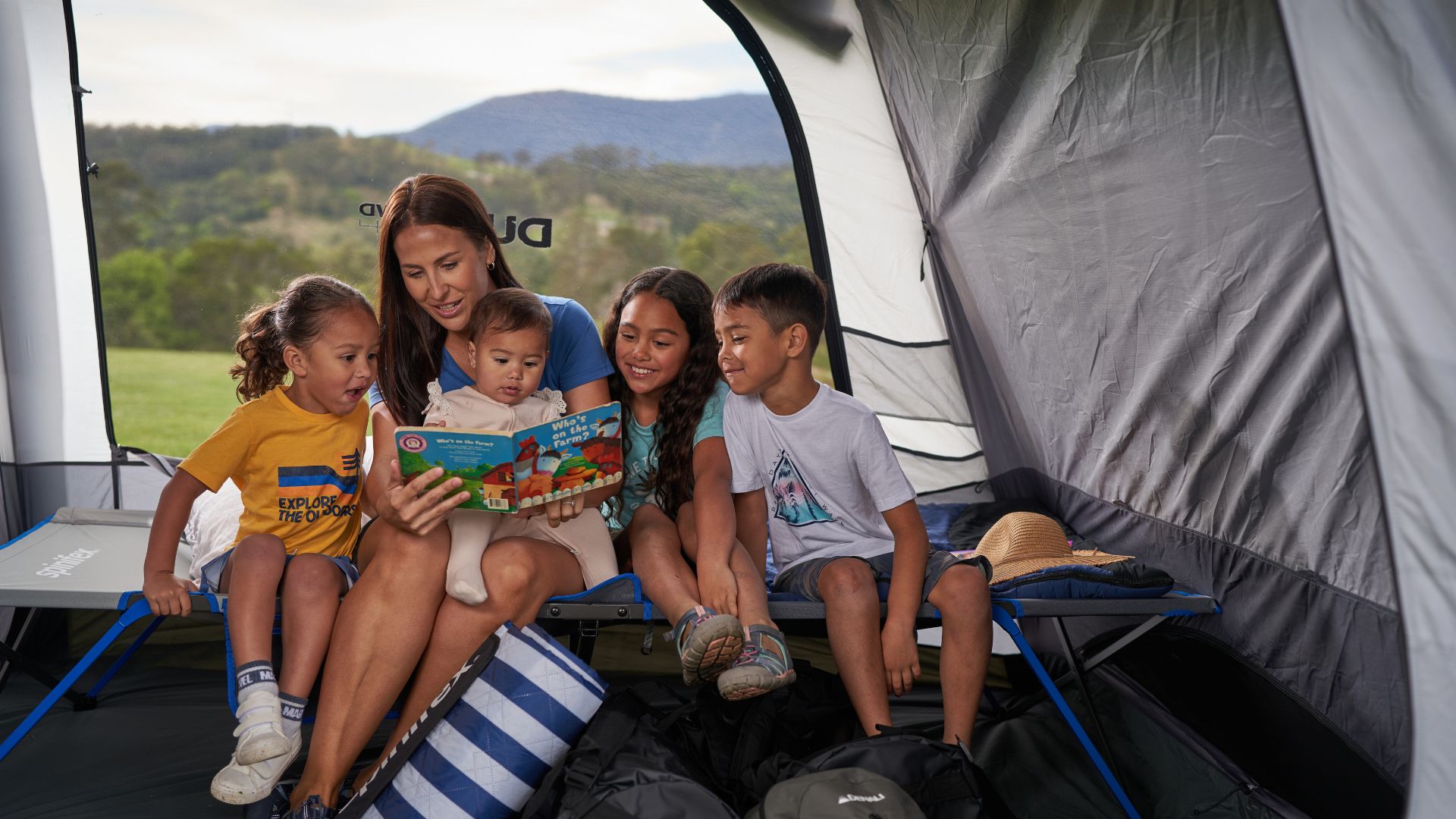 Reading a book together in a tent