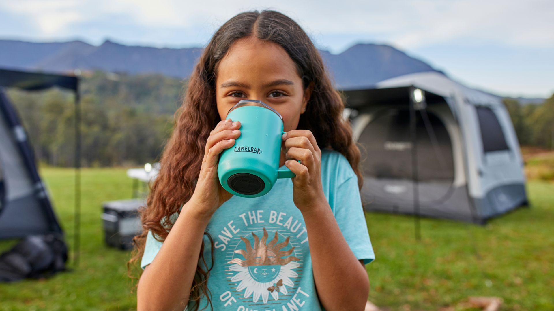 Girl drinking from a Camelbak cup