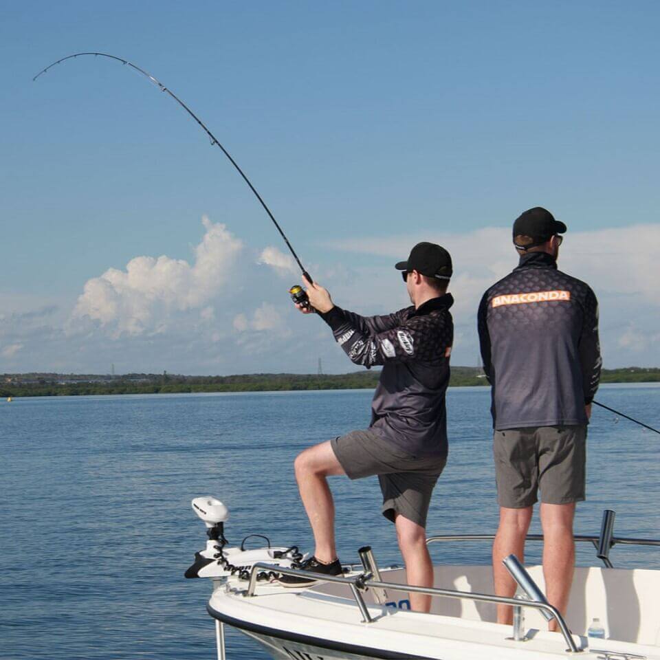 2 Men Fishing With Baitcaster Combos