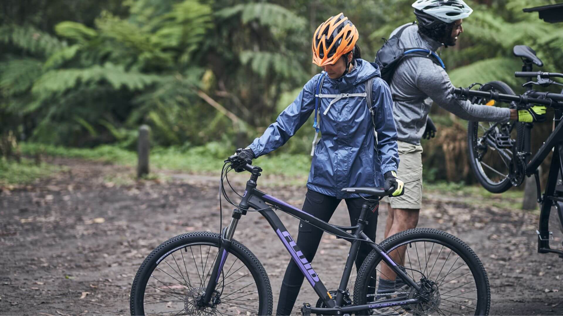 Woman Inspecting The Fluid Mountain Bike Seat