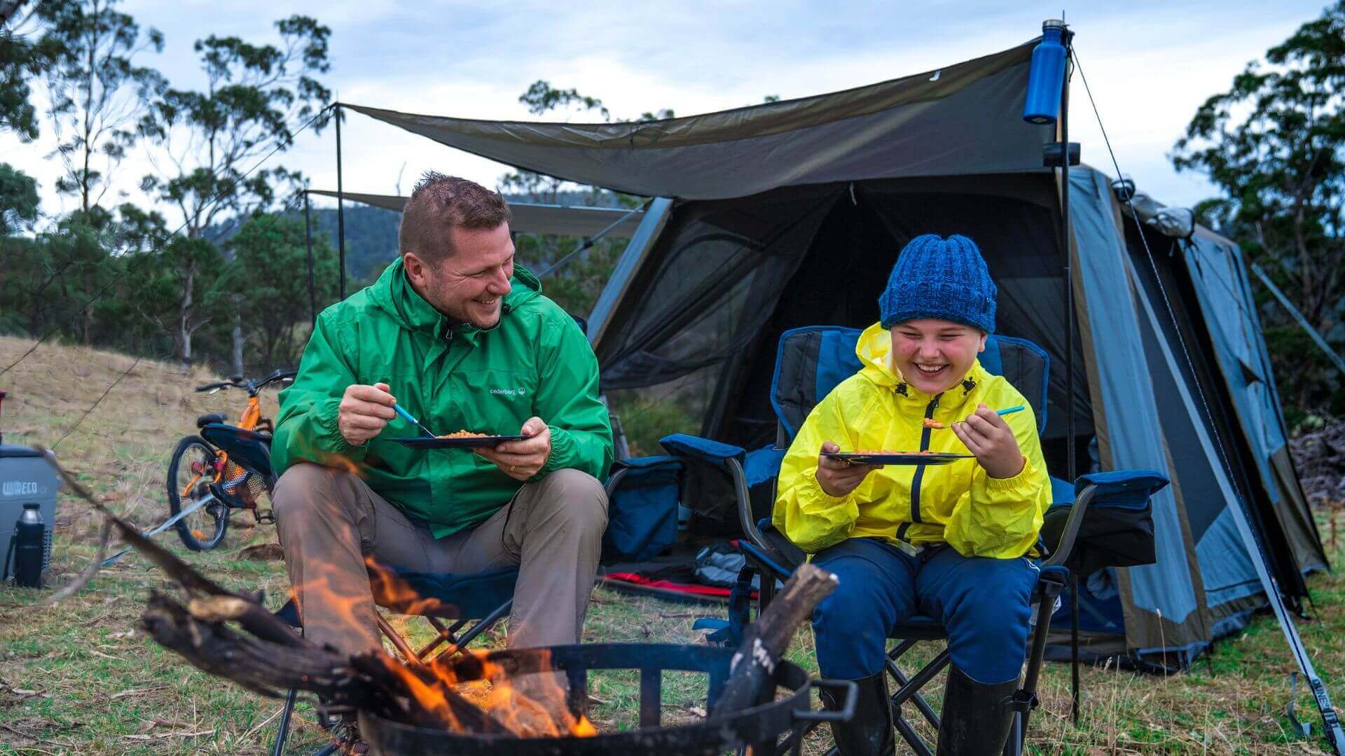 Father & Son Eating By The Campfire