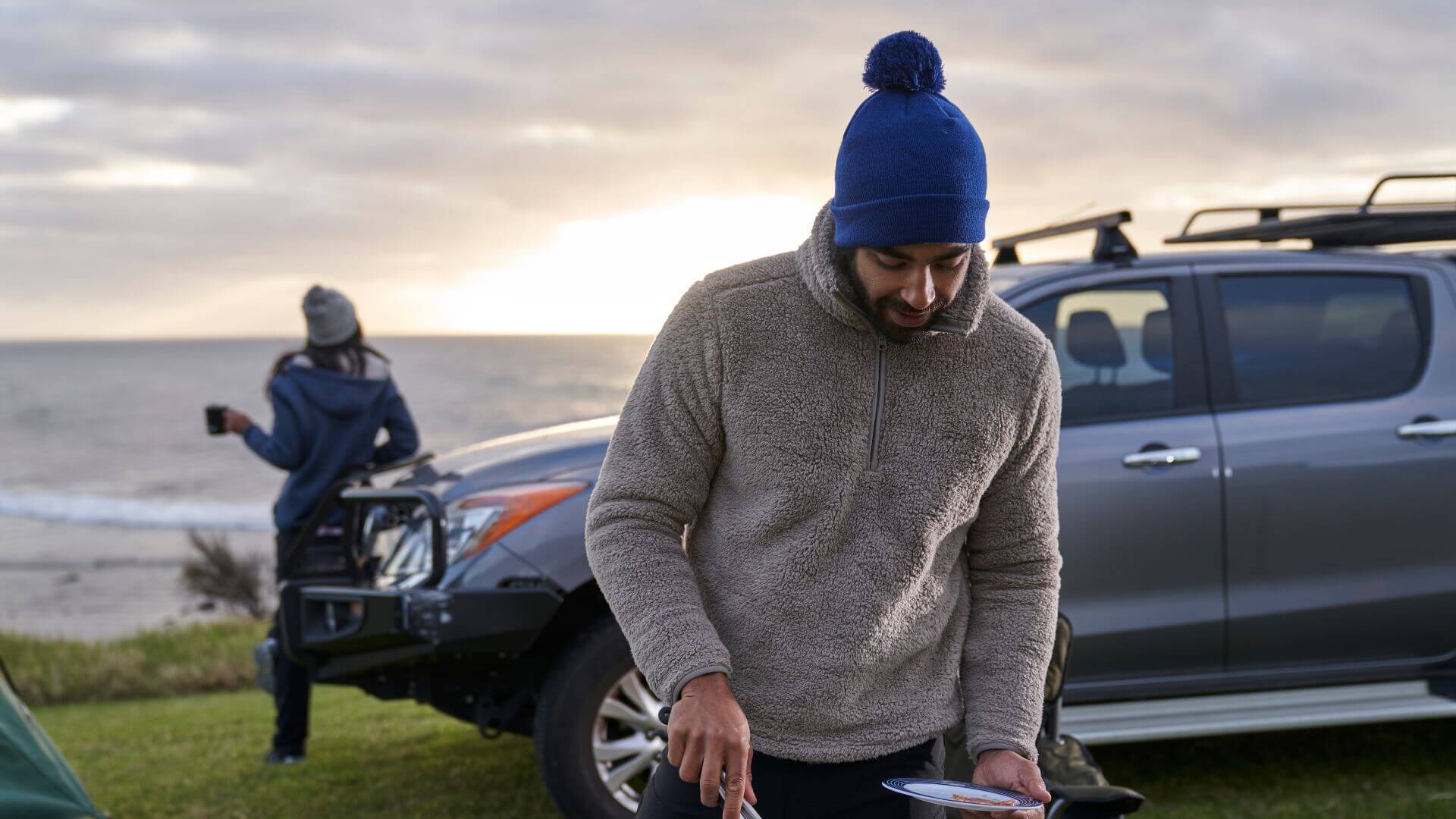 Couple Camping In Fleece Clothing