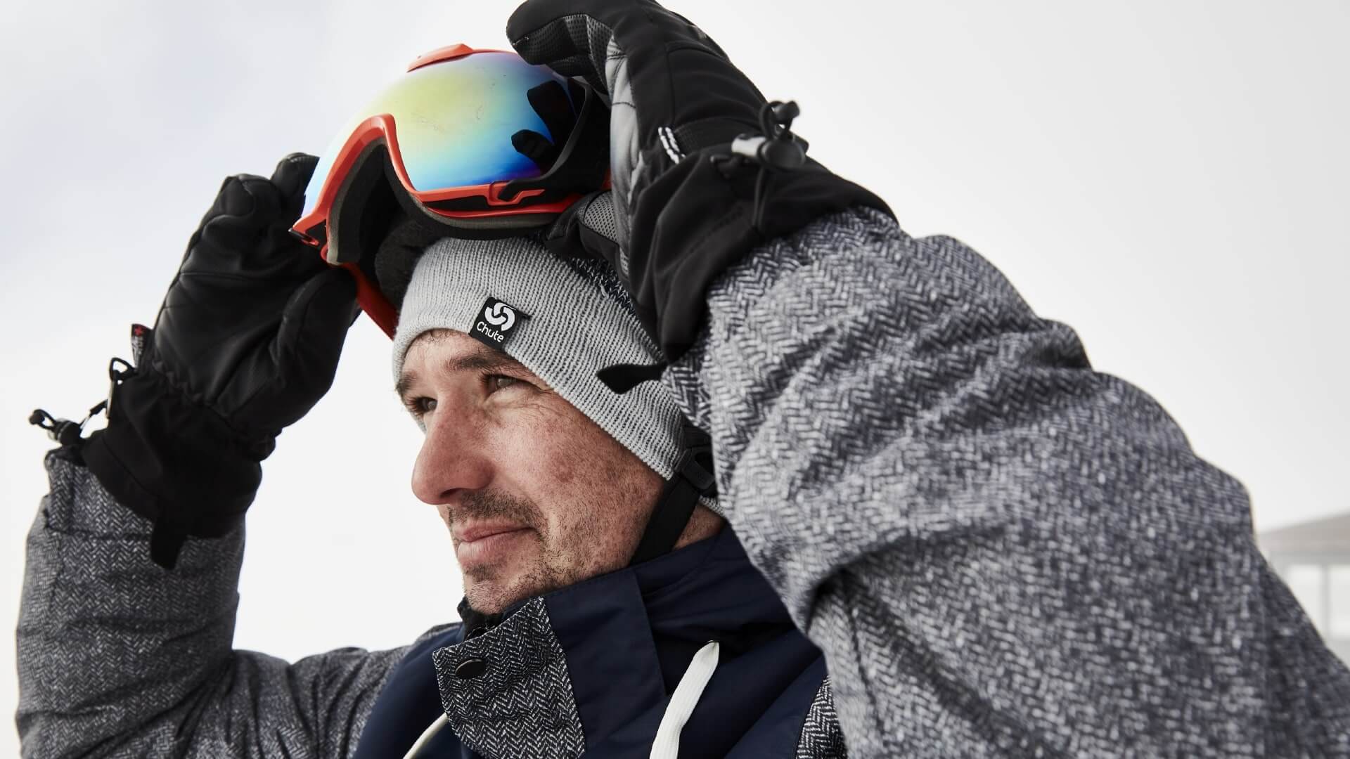 Man Wearing A Chute Knitted Navy Beanie